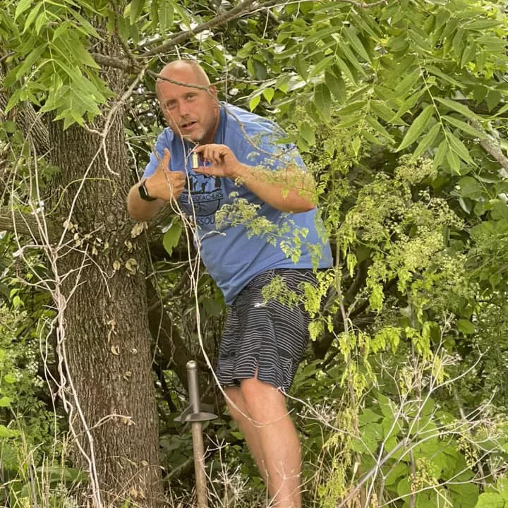 Charles Youngblood finding a geocache